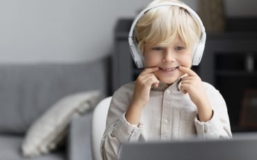 adorable-little-boy-doing-online-session-speech-therapy